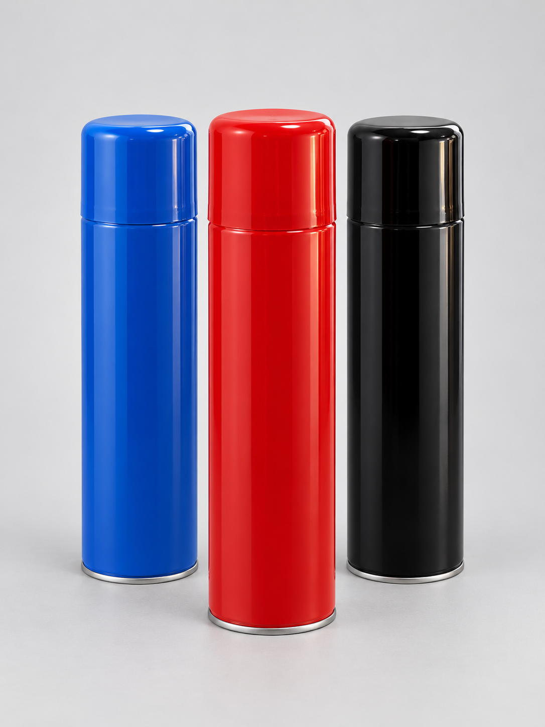 Sprays de pintura azul, vermelho e preto